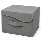Caja plegable con asa y tapa con abrojo gris